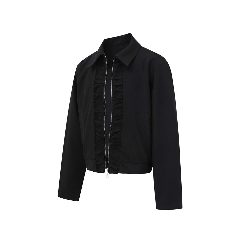 Black cropped jacket with a pointed collar, silver front zipper, gathered trim, long sleeves, and side pockets.
