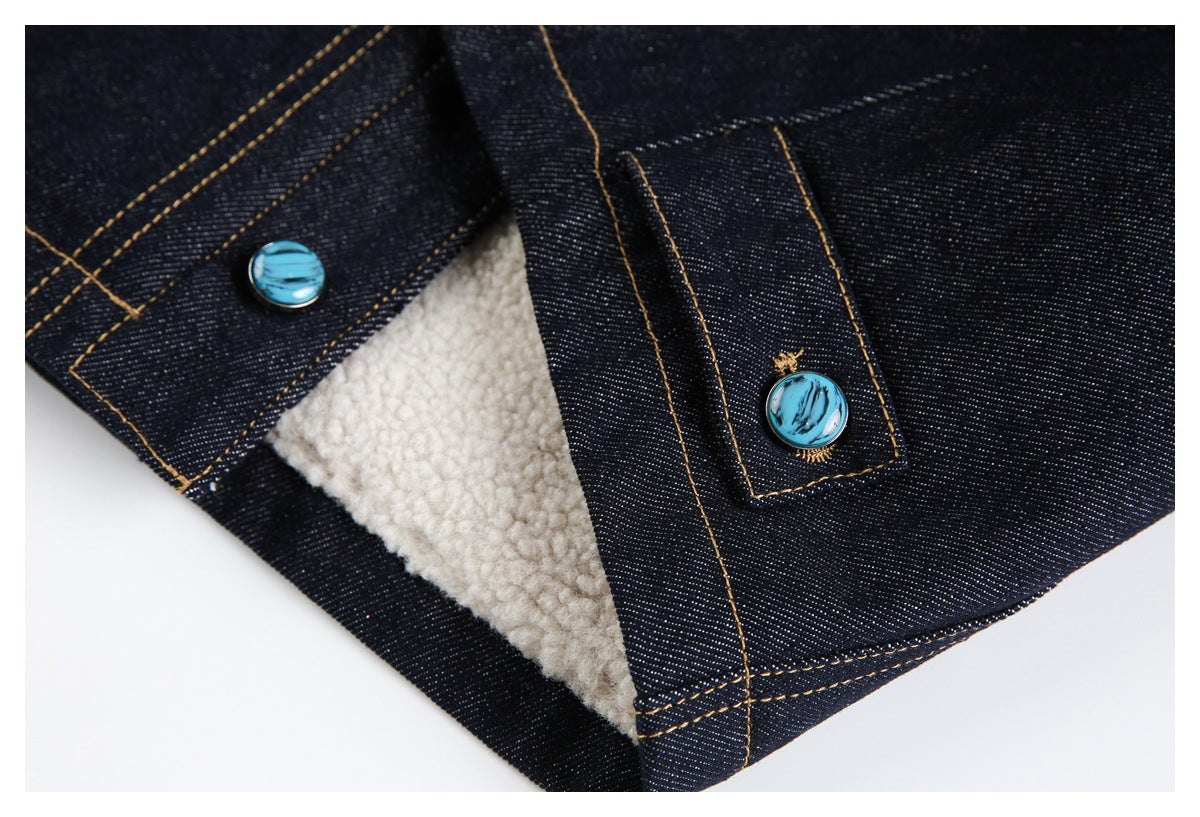 Dark denim garment detail showing cream sherpa lining and turquoise buttons.