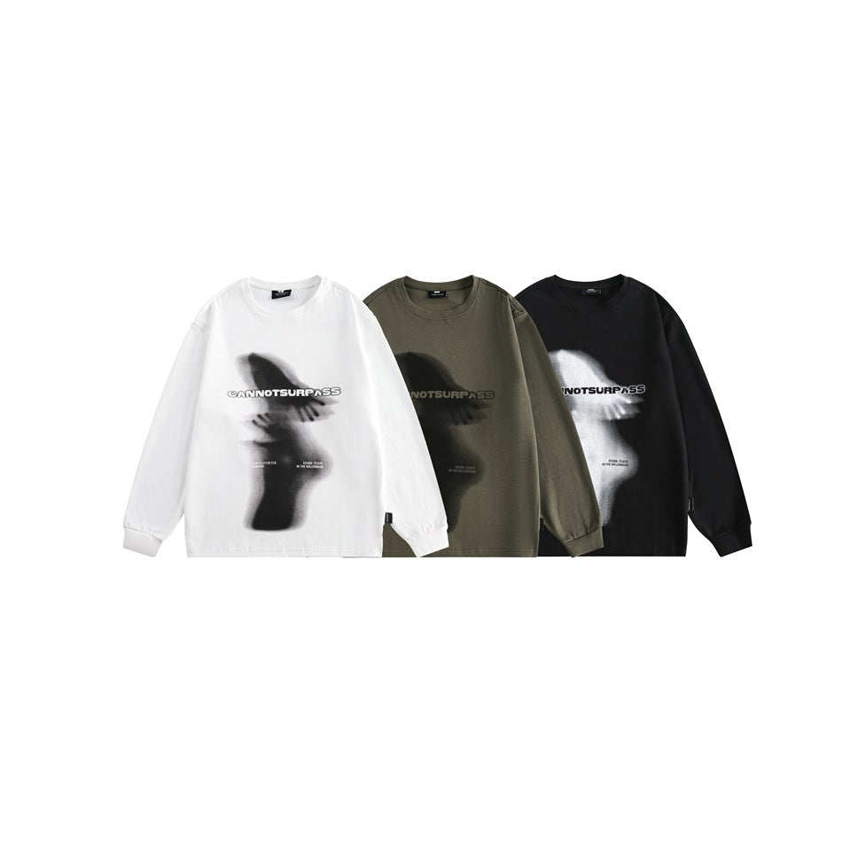 Three front views of the same graphic sweatshirt in white, olive gray, and black.