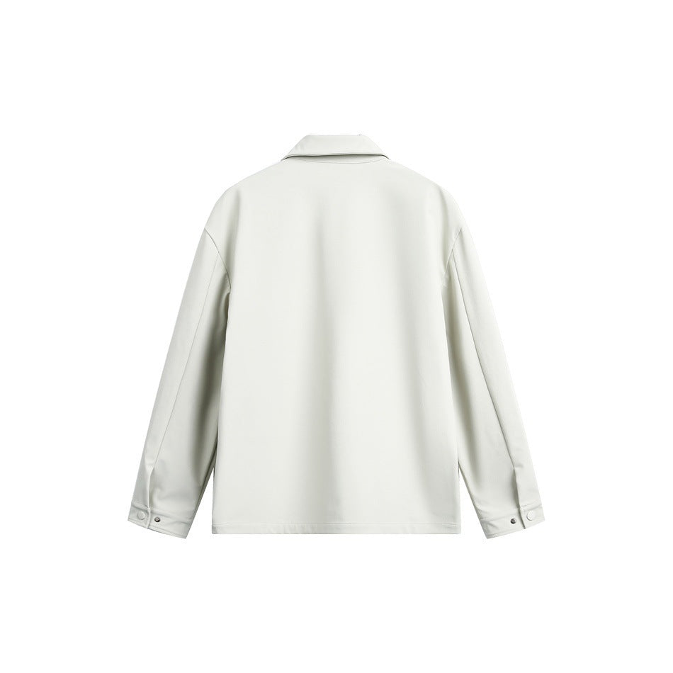 Back view of an off-white jacket with a folded collar and long sleeves with snap-tab cuffs.