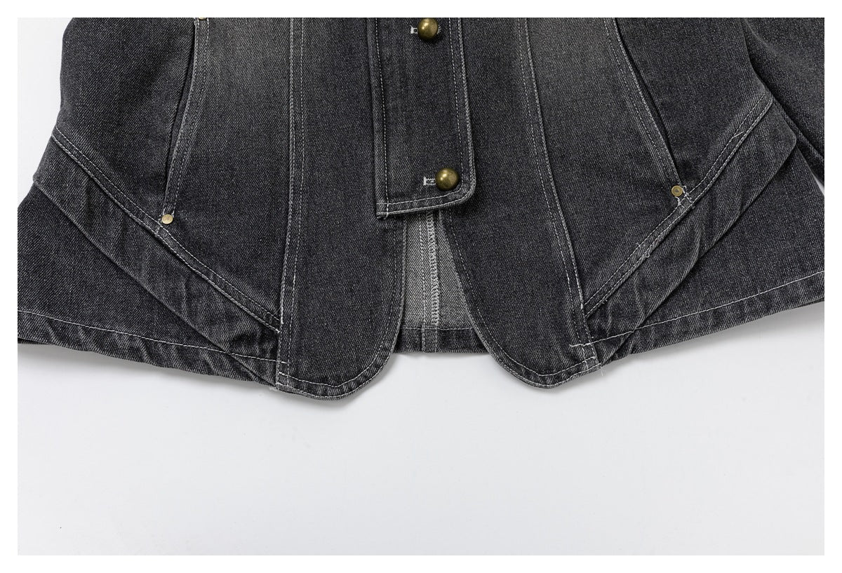 Close-up of the jacket's curved lower front panels, contrast stitching, and brass-tone button detail.