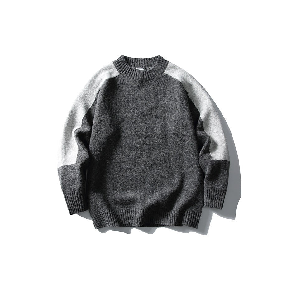 Dark gray crew-neck knit sweater with light gray shoulder and sleeve panels and ribbed trim, flat lay front view