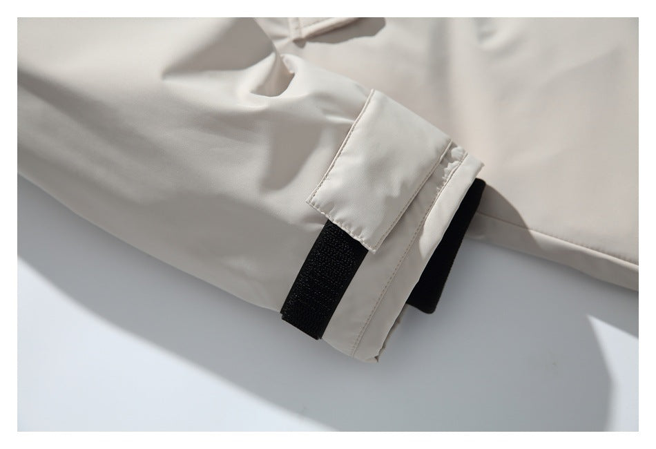 Close-up of the parka sleeve cuff with a black hook-and-loop adjustment strap.