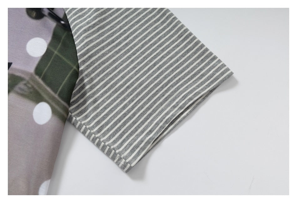 Close-up of a gray-and-white striped sleeve beside green and lilac fabric with large white dots.