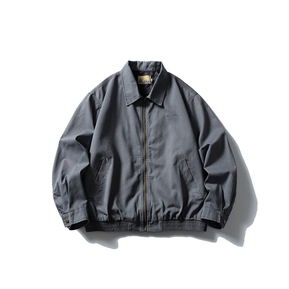 Gray-blue collared zip-front jacket flat lay with slanted pockets, snap cuffs and ribbed hem