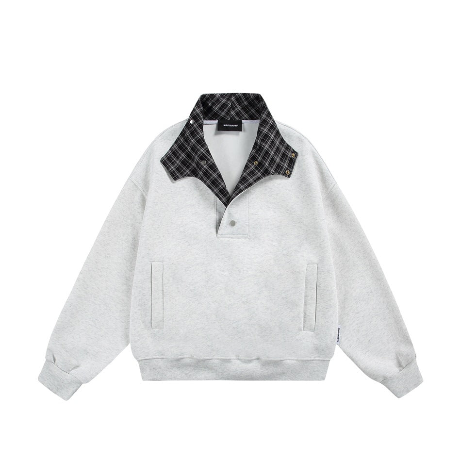 Light heather gray sweatshirt with collar opened to show black and white plaid inner collar and snaps