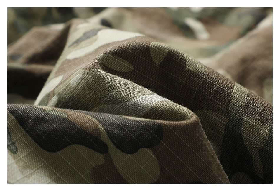 Close-up of olive, brown, and tan camouflage fabric gathered into soft folds.
