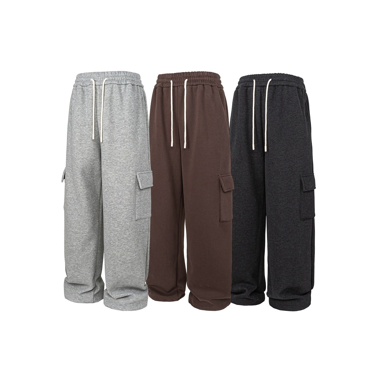 Three colors of wide-leg cargo pants shown from the front: light gray, brown, and charcoal, with drawstrings and flap