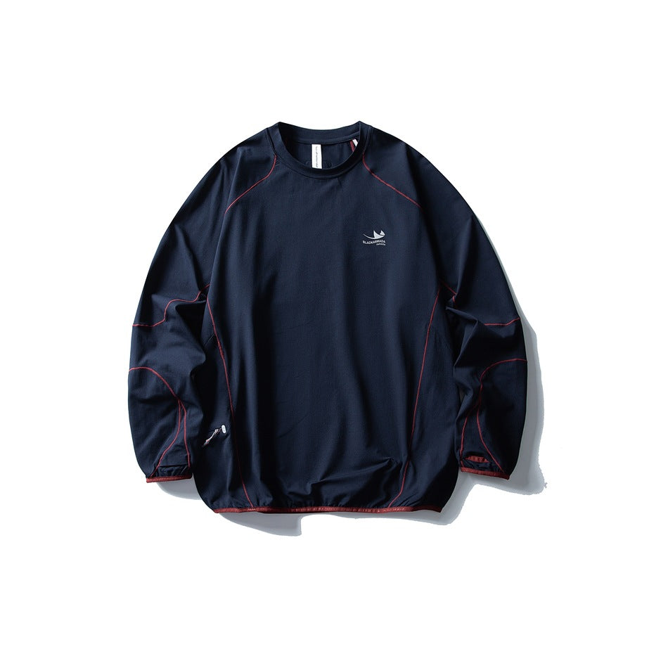 Navy blue long-sleeve crew-neck top flat lay with red contrast topstitching and binding at hem and cuffs