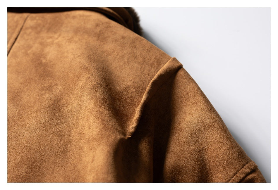 Close-up of the brown jacket's shoulder and sleeve seam.