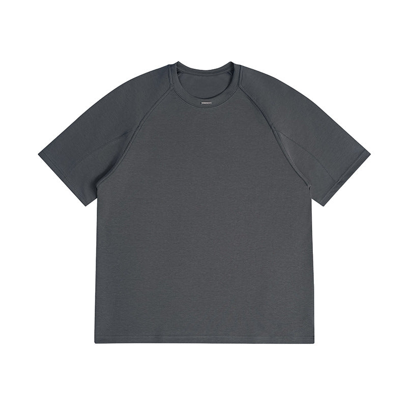Dark gray short-sleeve crew neck T-shirt with raglan sleeves and a small metal tag at the neckline, flat front view