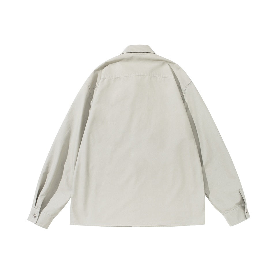Back view of an off-white long-sleeve button-up shirt with a yoke seam and buttoned cuffs.