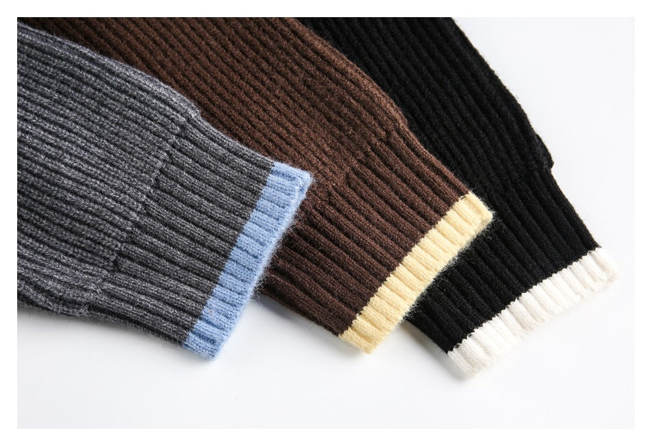 Close-up of ribbed sweater cuffs in gray with blue trim, brown with cream trim, and black with white trim.