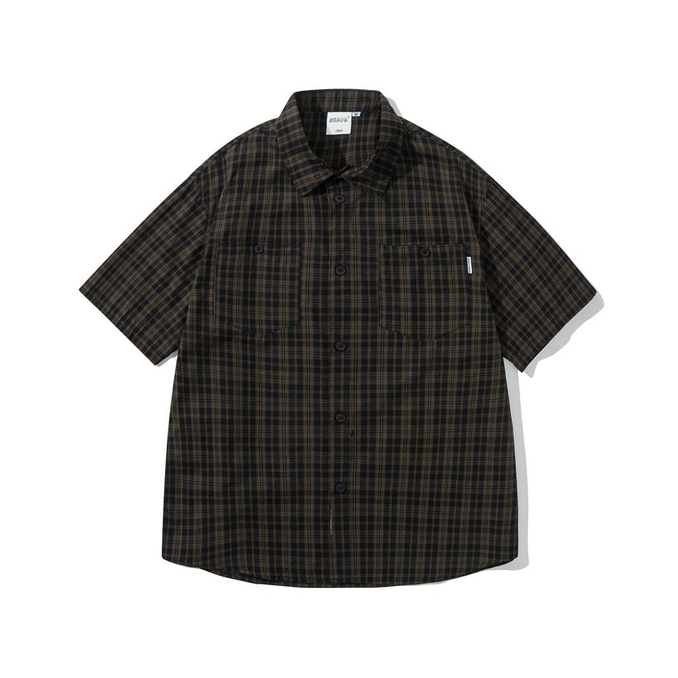 Black and olive plaid short-sleeve button-up shirt with two chest pockets, flat lay front view