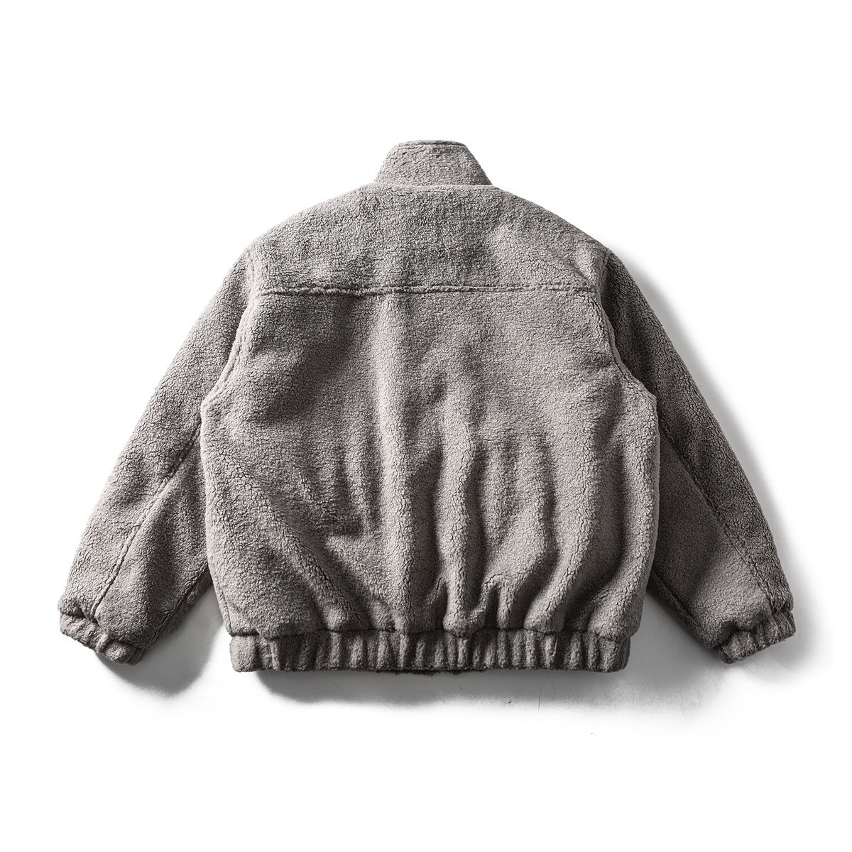 Back view of a gray textured jacket laid flat, with long sleeves, a high collar and gathered hem and cuffs.