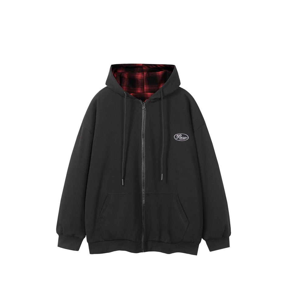 Black zip-up hooded sweatshirt flat lay with red and black plaid hood lining and embroidered chest patch