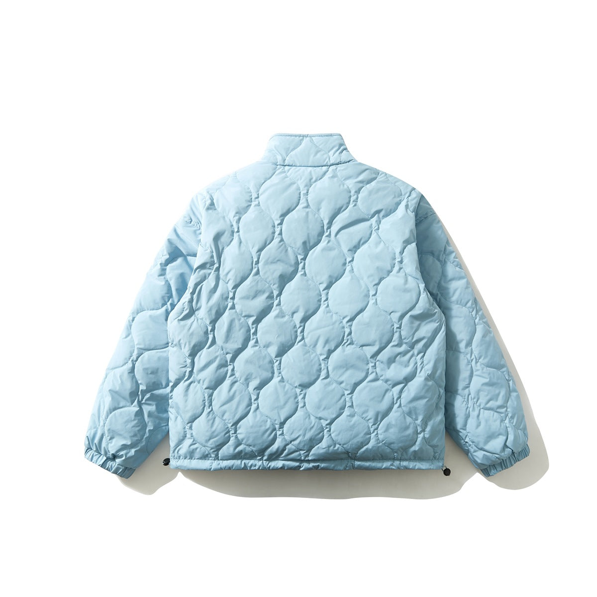 Back view of a light blue quilted jacket with rounded stitched panels, standing collar, and elasticated cuffs.