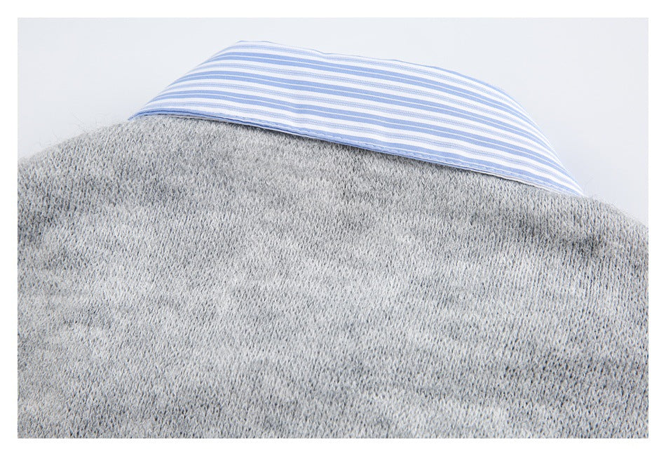 Close-up of the gray knit garment's back collar, lined with blue-and-white stripes.