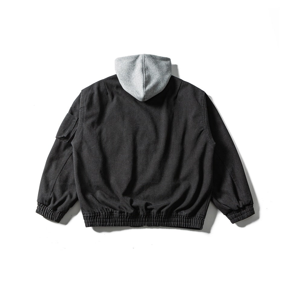Back view of a black bomber-style jacket with gray hood, elastic hem and cuffs, and a sleeve pocket