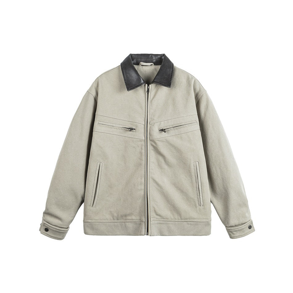 Khaki zip-front jacket with dark gray leather-look collar, chest zip pockets and snap cuffs, flat lay