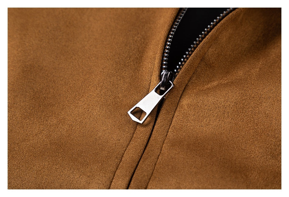 Close-up of a silver zipper on a camel-brown garment.