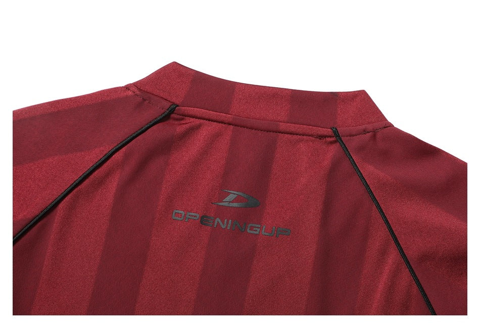 Close-up of the jersey's striped back, showing the collar, black piping, and small logo.