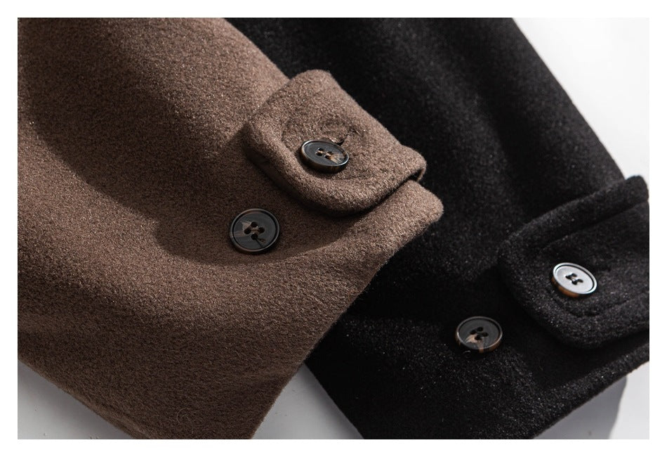 Close-up of brown and black coat cuffs with dark buttons.