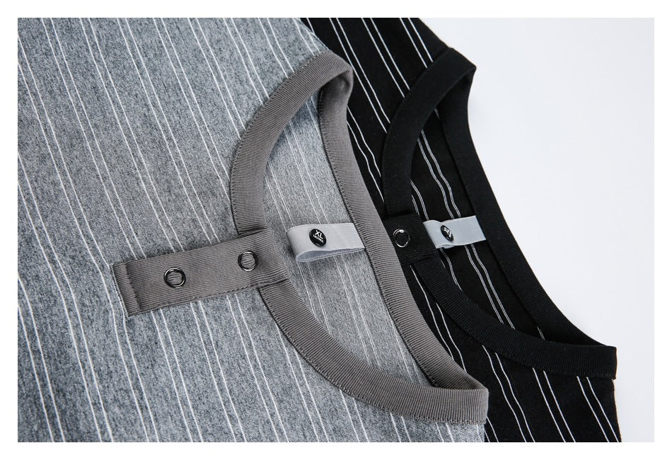 Close-up of gray and black vertically striped knit tops, showing ribbed necklines and button plackets.