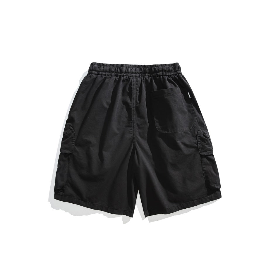 Back view of black cargo shorts laid flat, with an elastic waistband, rear patch pocket, and side pockets.