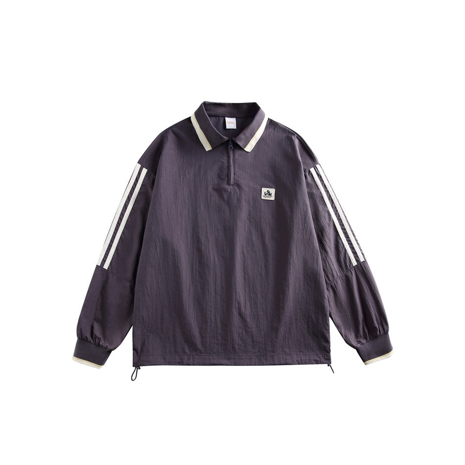 Purple quarter-zip polo-collar jacket with cream collar, cuff and sleeve stripes, chest patch and hem drawcords