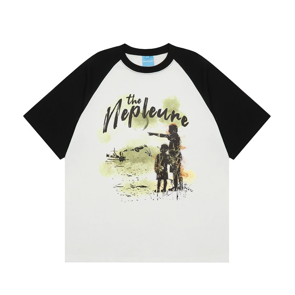 Black and white raglan short-sleeve T-shirt with a front graphic of two child silhouettes and script text