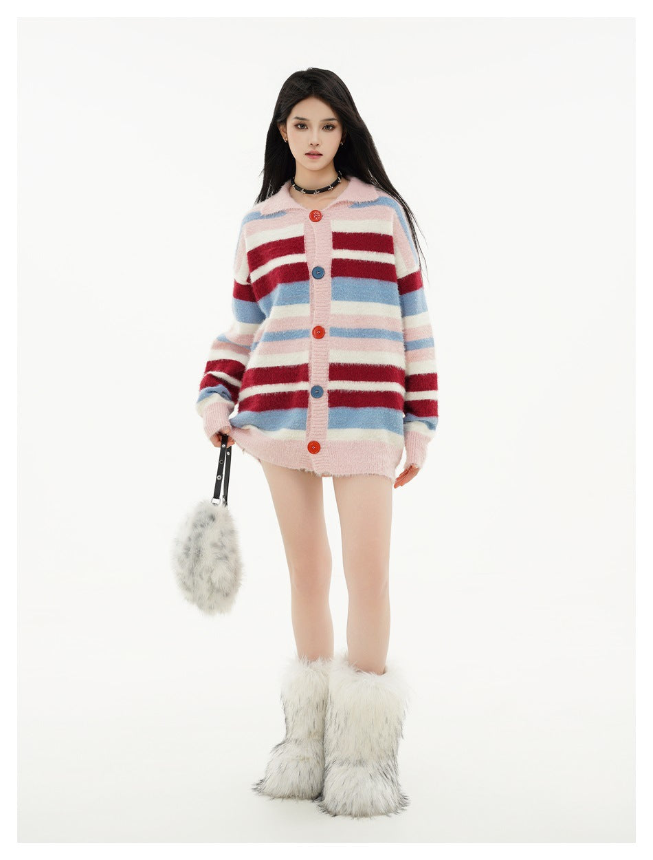 Full-length model wearing a striped oversized pink cardigan with colorful buttons and furry white boots.