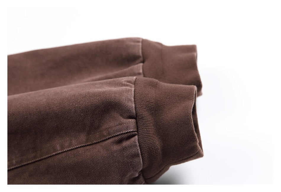 Close-up of the brown hoodie’s sleeves and ribbed cuffs.