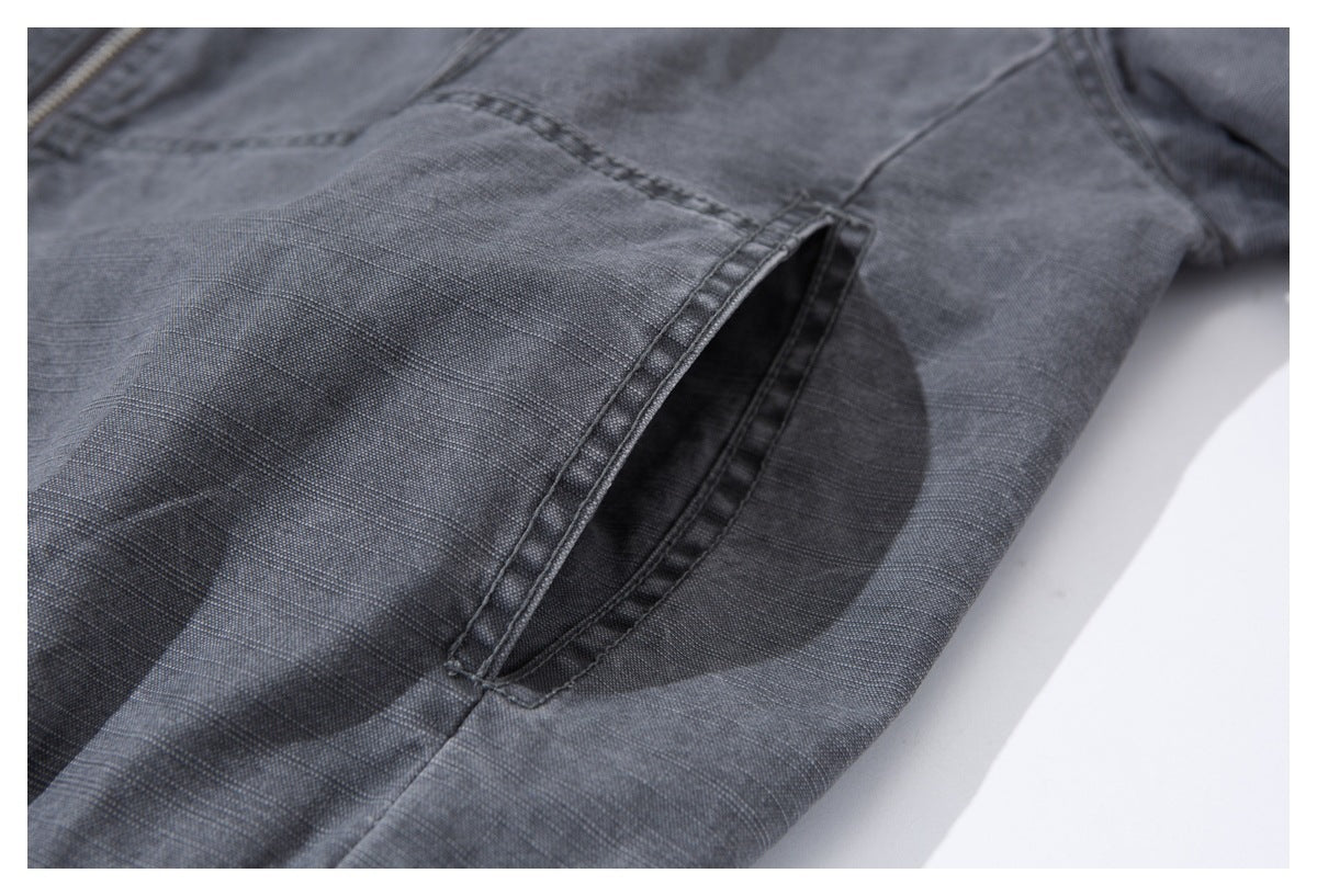 Close-up of an open side pocket on the charcoal-gray jacket.