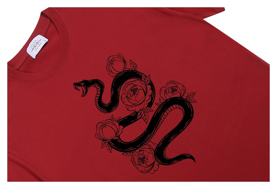 Dark red T-shirt laid flat, showing a black snake-and-flower graphic on the front.