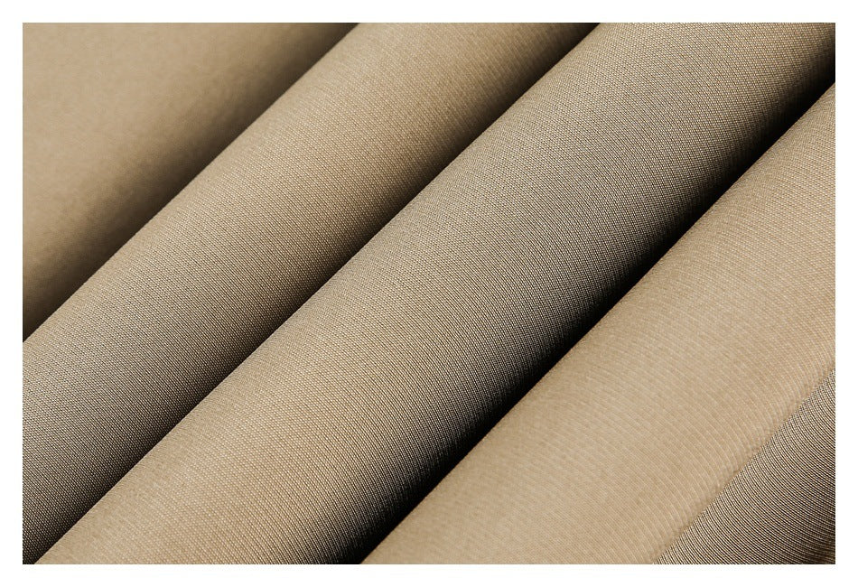 Close-up of several folded fabric sections in shades of beige and taupe.