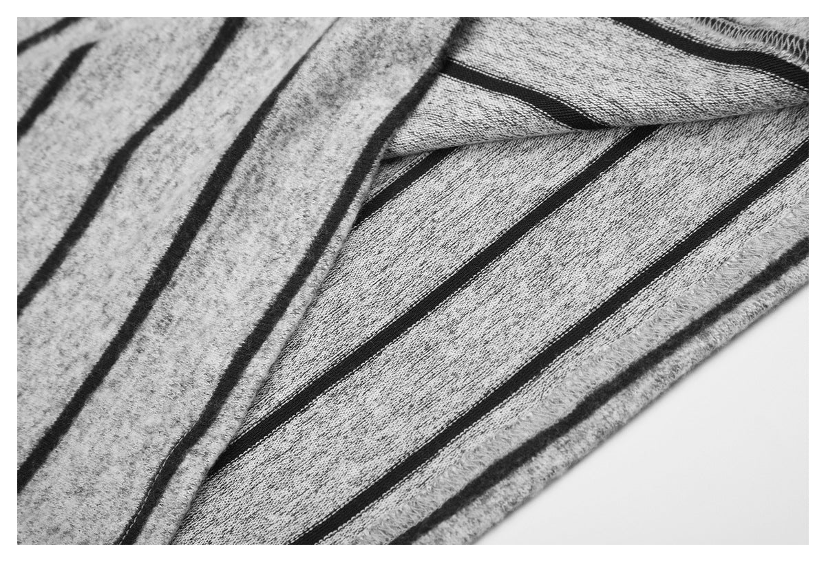 Close-up of the striped shirt's inside fabric and overlocked seam stitching.