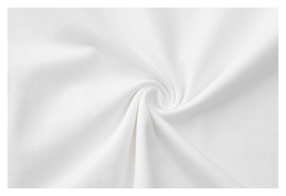Close-up of white garment fabric gathered into a twist, showing its surface texture.