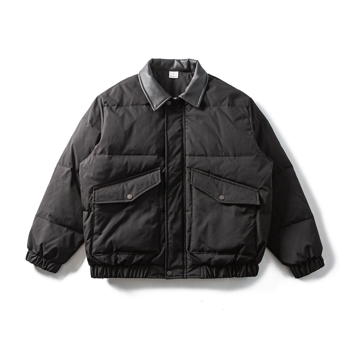 Black quilted jacket laid flat, front view, with leather-look collar, two snap flap pockets and elastic cuffs and hem