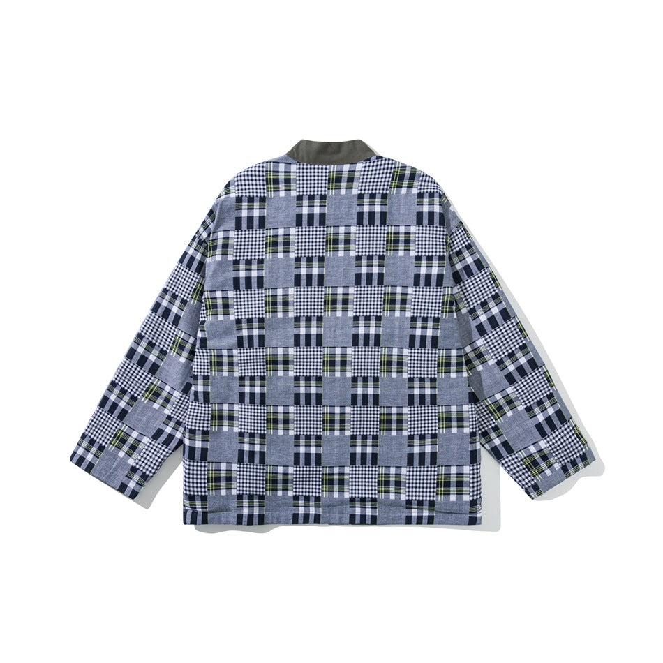 Back view of a gray, navy, white, and olive patchwork plaid jacket with a solid dark collar.