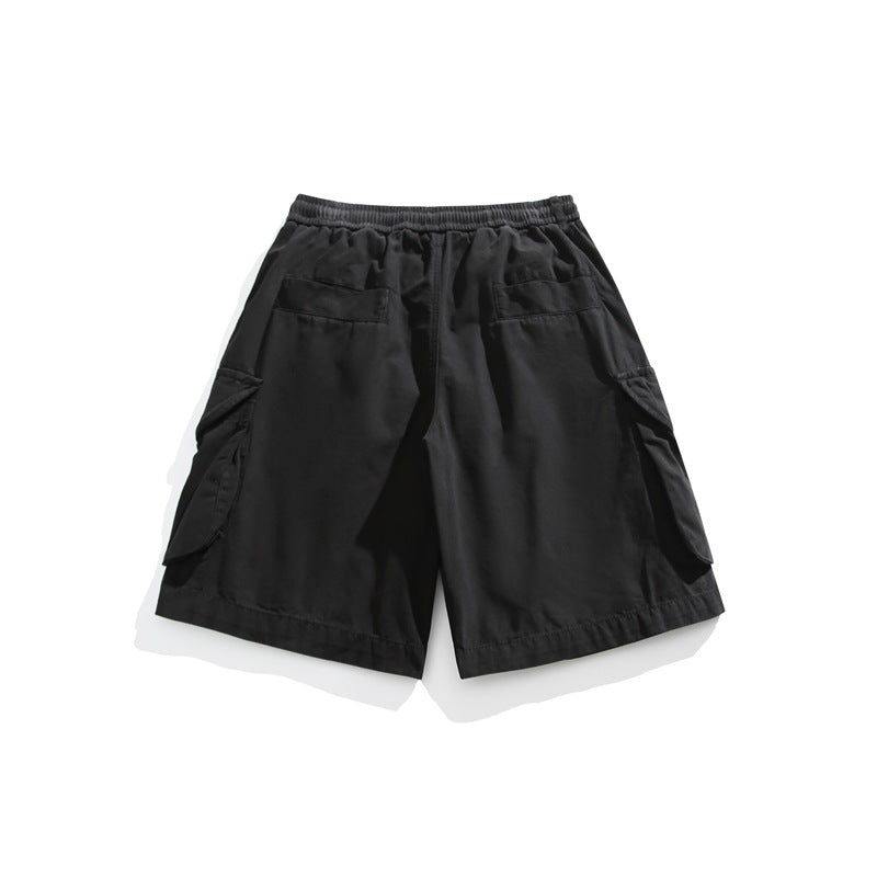Back view of black cargo shorts laid flat, showing an elastic waistband, two rear pockets, and side cargo pockets.