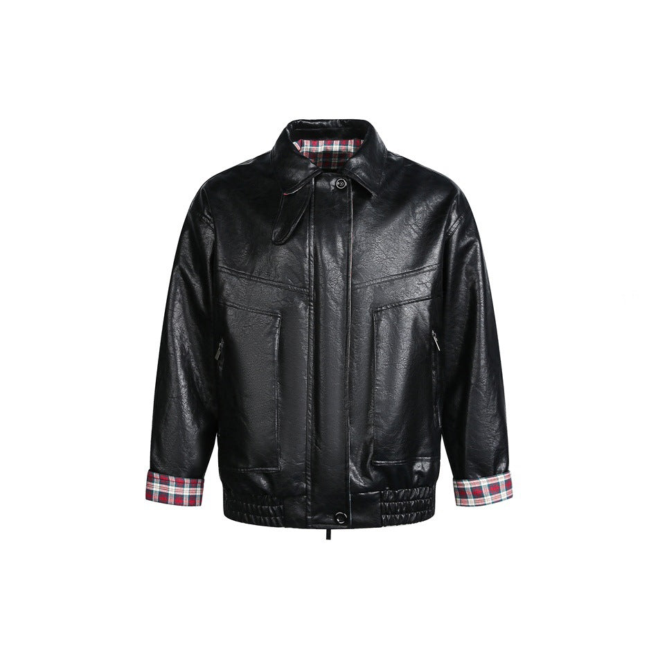 Black faux-leather jacket front view with collar, large pockets, elastic hem and plaid cuffs