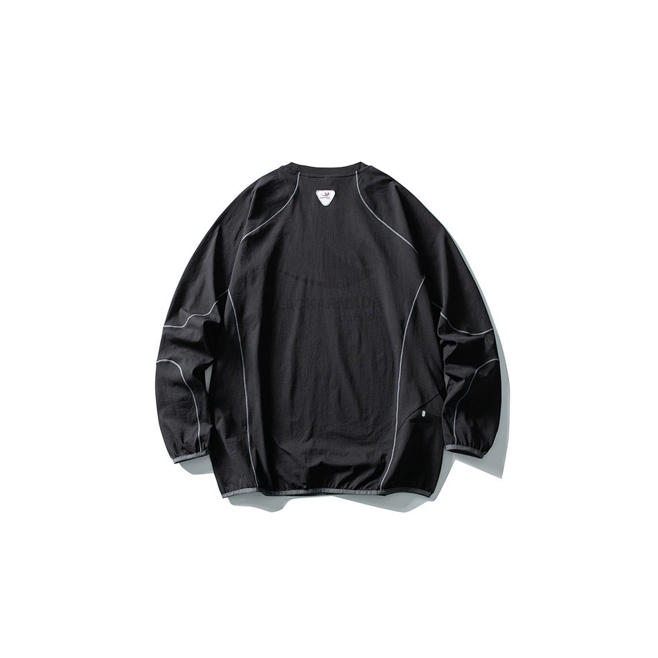 Back view of a black pullover with long raglan sleeves and light gray contrast piping.