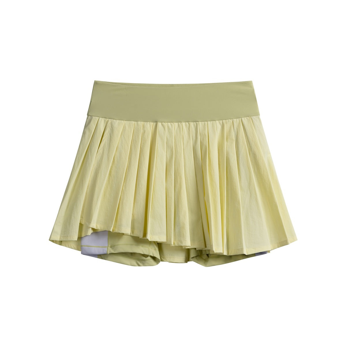 Front view of a pale yellow pleated tennis skort with a wide smooth waistband and built-in shorts.