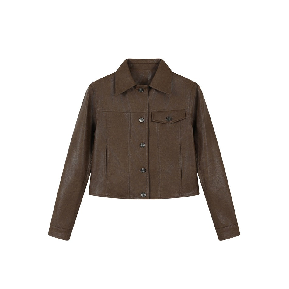 Brown cropped faux-leather-look jacket with pointed collar, button front and chest flap pocket, flat front view