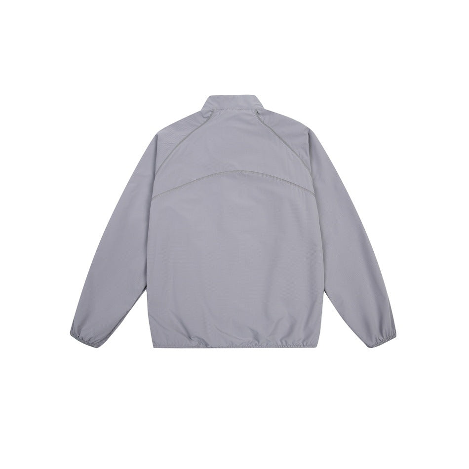 Back view of a light gray zip-up jacket with a stand collar, curved seam across the upper back, and elasticated cuffs and