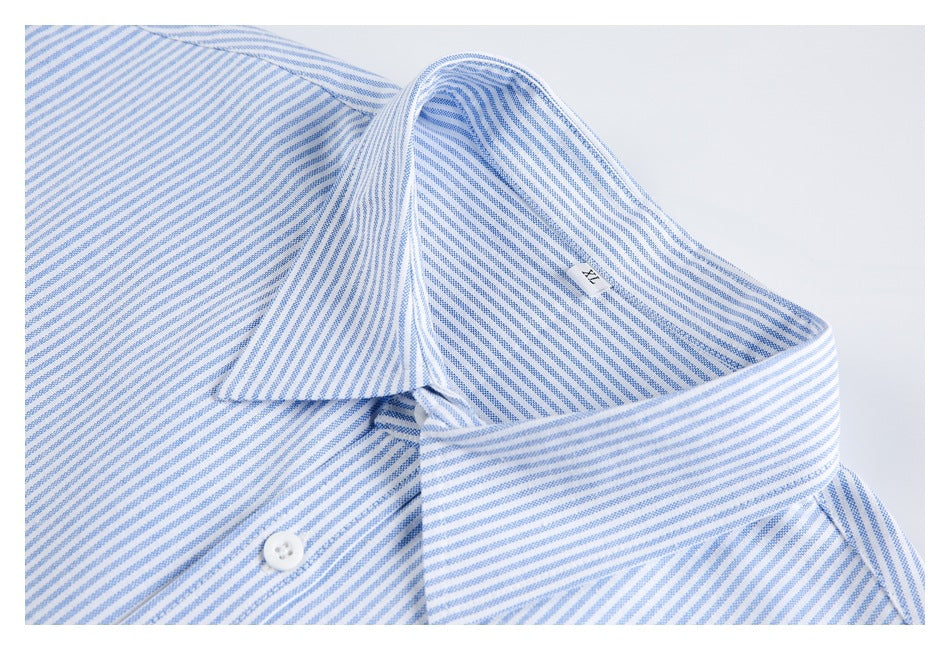 Close-up of a blue-and-white striped shirt collar and upper placket with a white button.