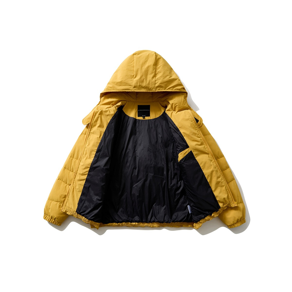 Mustard-yellow hooded puffer jacket opened to show its dark lining and interior pocket.
