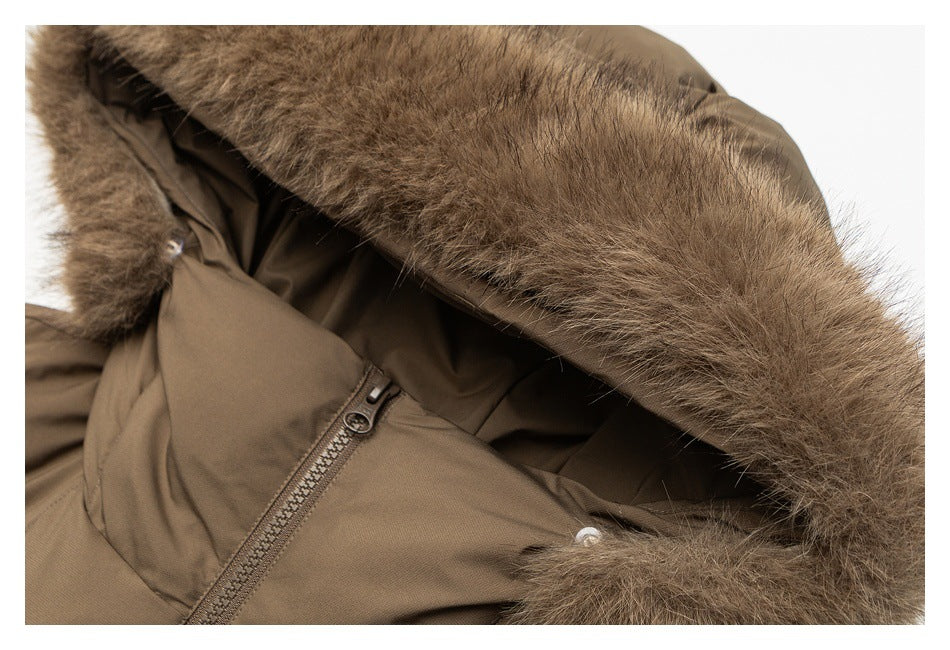 Close-up of a brown jacket hood edged with thick brown fur trim.