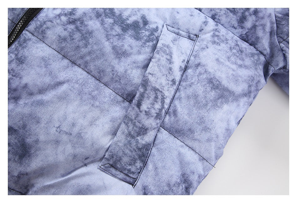 Close-up of a long welt pocket on the mottled blue-gray jacket panel.